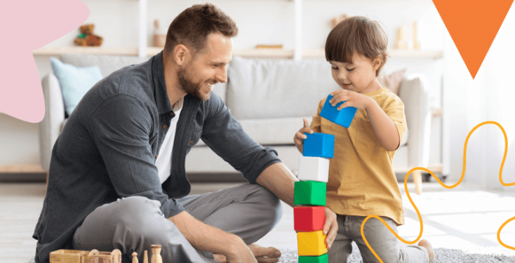 pai brincando com filho na sala de estar utilizando brinquedos de madeira